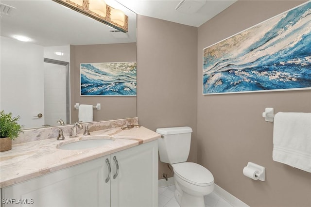 bathroom featuring tile patterned flooring, vanity, toilet, and an enclosed shower