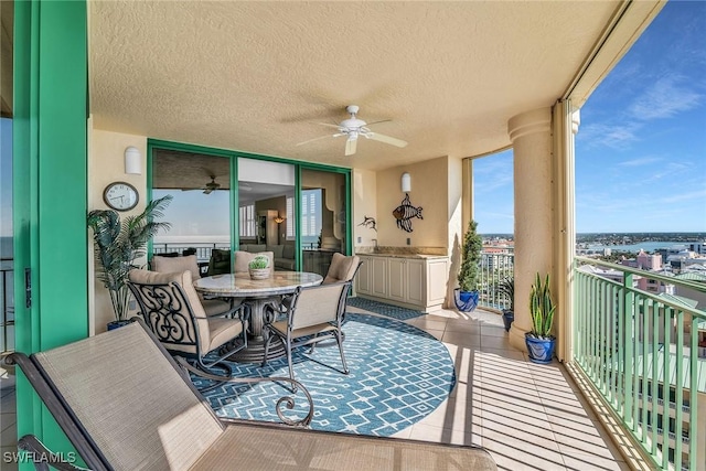 balcony featuring ceiling fan