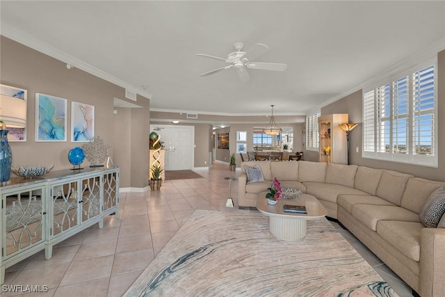 tiled living room featuring ceiling fan and crown molding