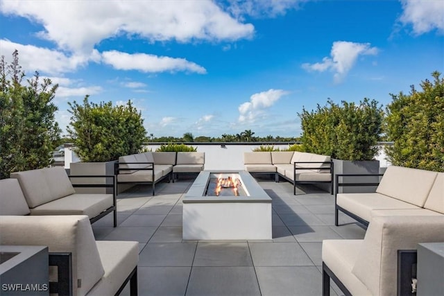 view of patio featuring an outdoor living space with a fire pit