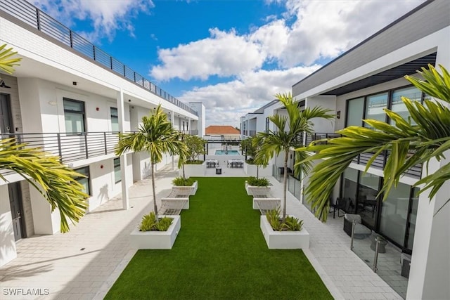 850 Central Ave Unit 311, Naples, FL 34102 - view of community featuring a lawn