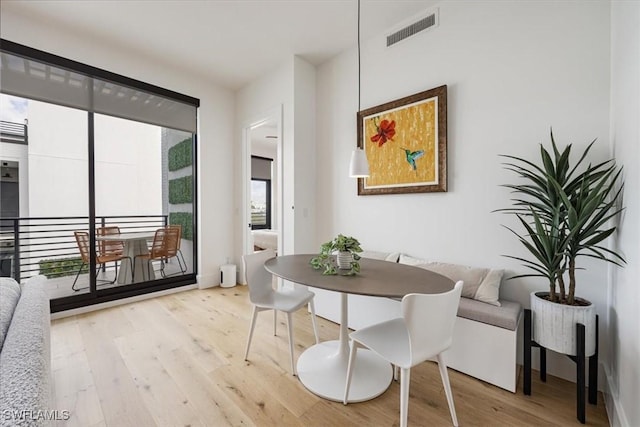 dining space with light wood-type flooring