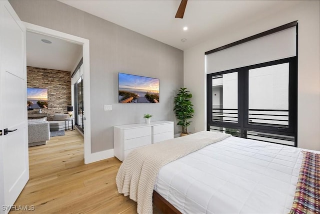 bedroom with light wood-type flooring and ceiling fan