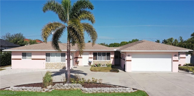 single story home featuring a garage