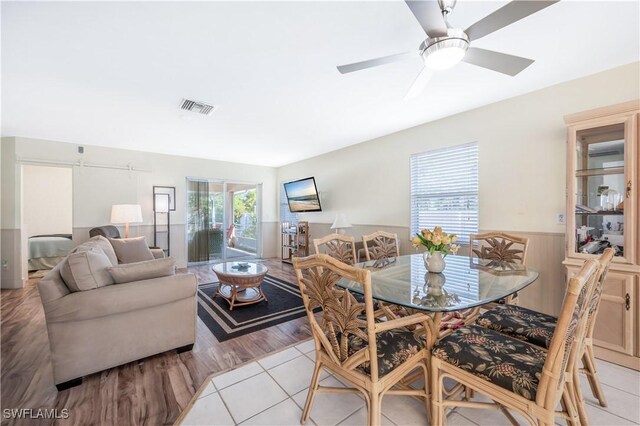 dining room with ceiling fan and light tile patterned flooring