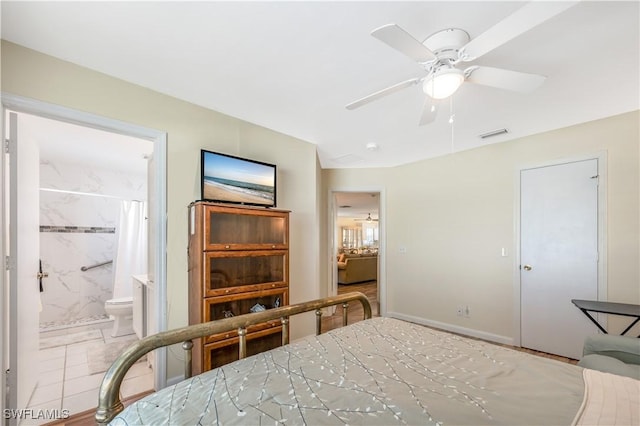 bedroom with ensuite bath and ceiling fan