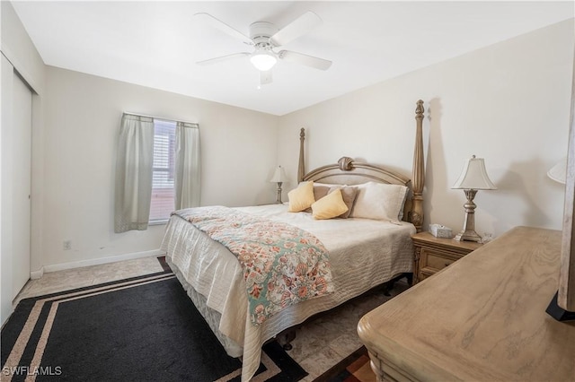 bedroom featuring ceiling fan and a closet