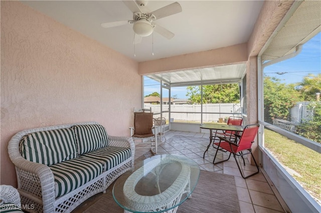 sunroom / solarium featuring ceiling fan