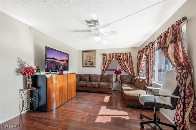 interior space featuring a textured ceiling, dark hardwood / wood-style floors, and ceiling fan