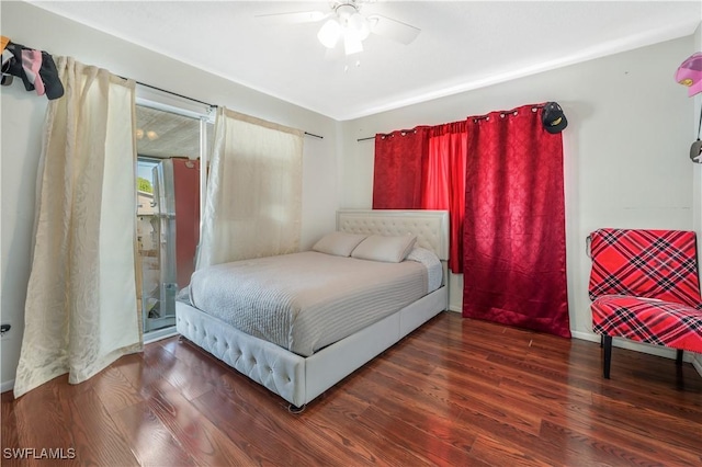 bedroom featuring ceiling fan and dark wood-type flooring