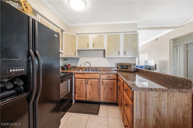 kitchen with dark stone counters, ornamental molding, sink, black appliances, and light tile patterned floors