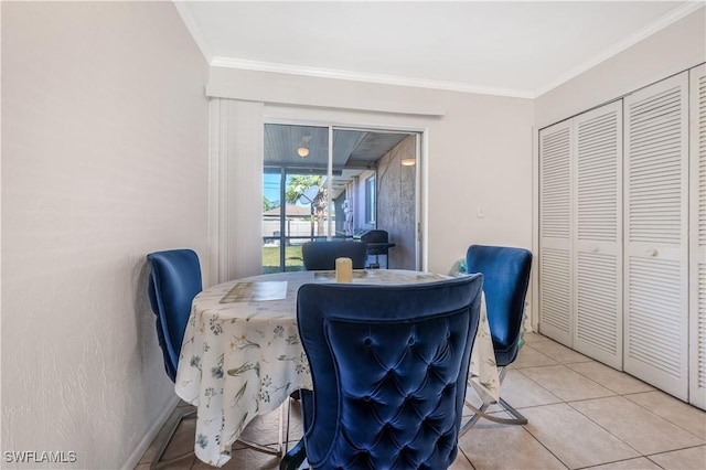 tiled dining room with crown molding