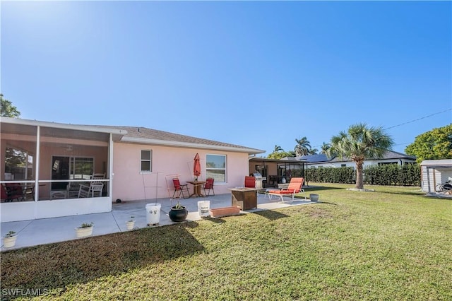 view of yard featuring a patio area and a sunroom