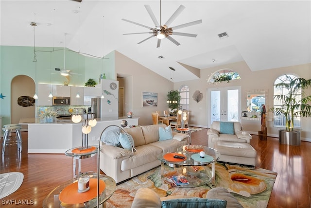 living room featuring french doors, high vaulted ceiling, ceiling fan, and hardwood / wood-style floors