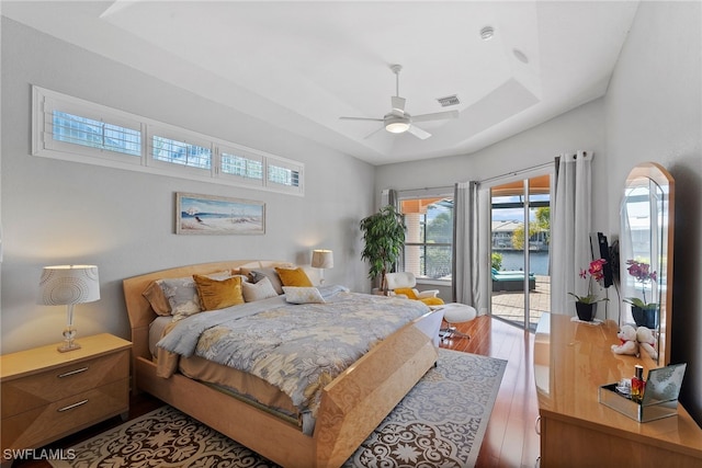 bedroom featuring access to outside, ceiling fan, and hardwood / wood-style floors