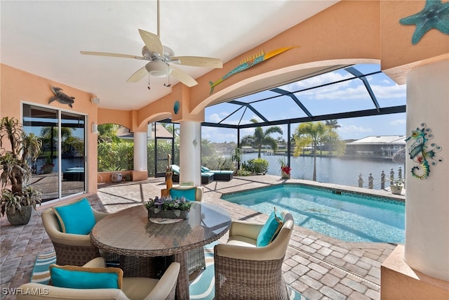 view of swimming pool featuring a lanai, an outdoor living space, ceiling fan, a water view, and a patio area