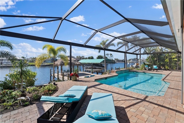 view of swimming pool with a boat dock, a patio, a water view, and a lanai