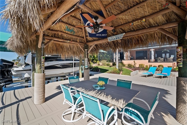 dock area with a gazebo and a wooden deck