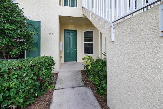 doorway to property featuring a balcony