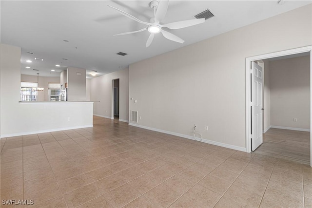 unfurnished living room with light tile patterned floors and ceiling fan with notable chandelier