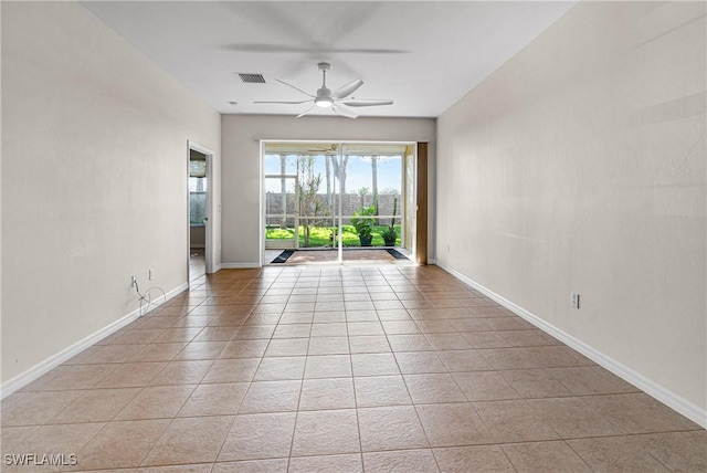 unfurnished room featuring ceiling fan and light tile patterned flooring