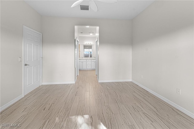 spare room with light hardwood / wood-style floors