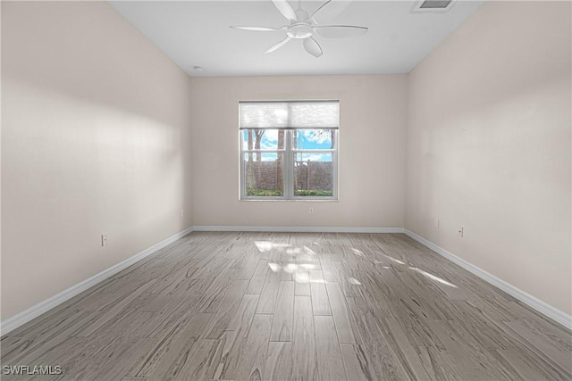 unfurnished room with ceiling fan and light wood-type flooring