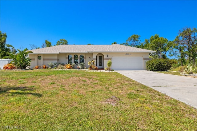 ranch-style house featuring a garage and a front yard