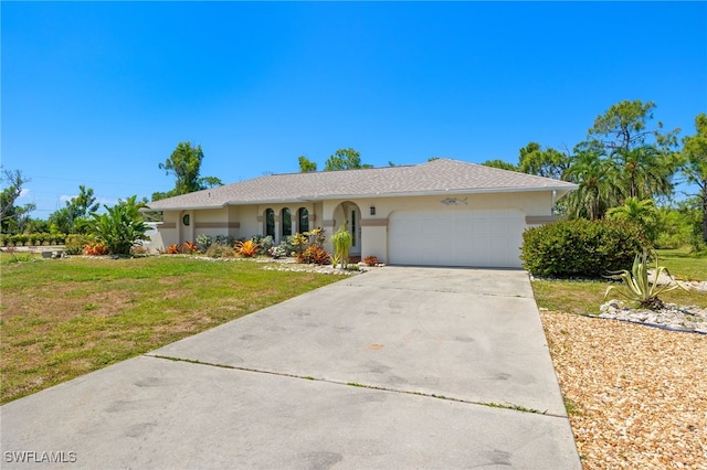 ranch-style home with a garage and a front lawn