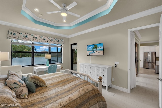 bedroom with ceiling fan, a raised ceiling, stainless steel refrigerator with ice dispenser, and crown molding