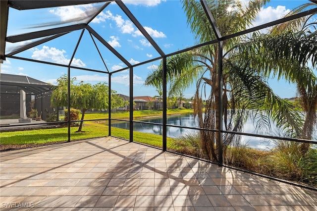 unfurnished sunroom with a water view