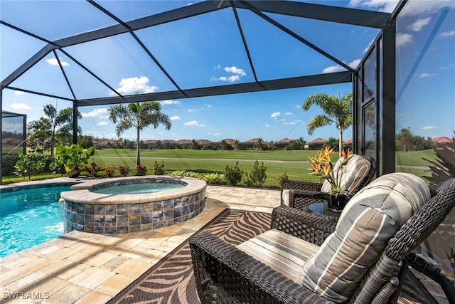 view of patio / terrace featuring a lanai and a pool with hot tub