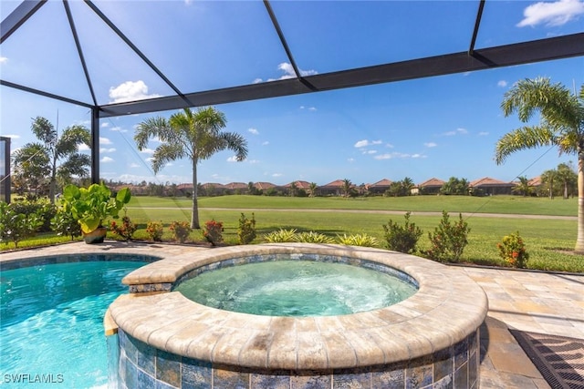 view of swimming pool featuring an in ground hot tub, a patio area, and a lanai