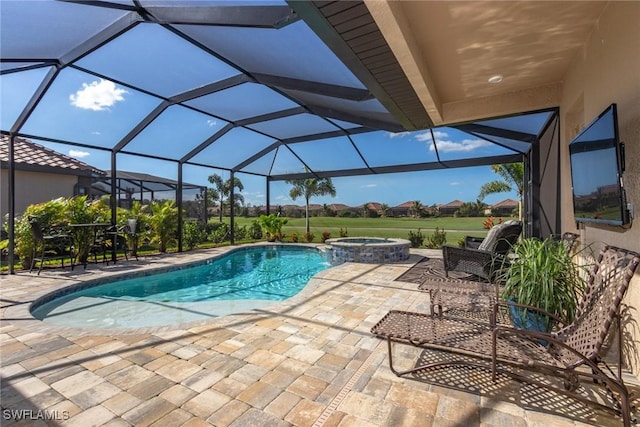 view of pool with a patio area, a lanai, and an in ground hot tub