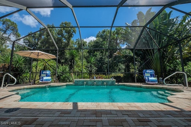 view of swimming pool with a lanai, a patio area, and pool water feature