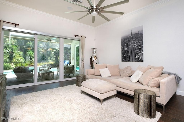 living room featuring dark hardwood / wood-style flooring and crown molding