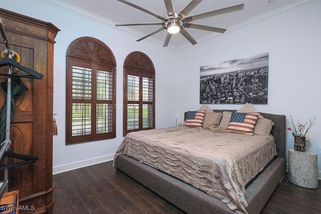 bedroom featuring ceiling fan, crown molding, and dark wood-type flooring