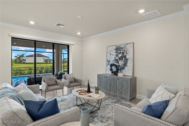 living room with light hardwood / wood-style floors and ornamental molding