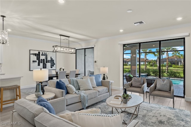 living room featuring light hardwood / wood-style floors and ornamental molding