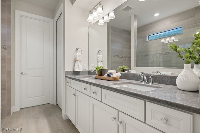 bathroom featuring vanity and walk in shower