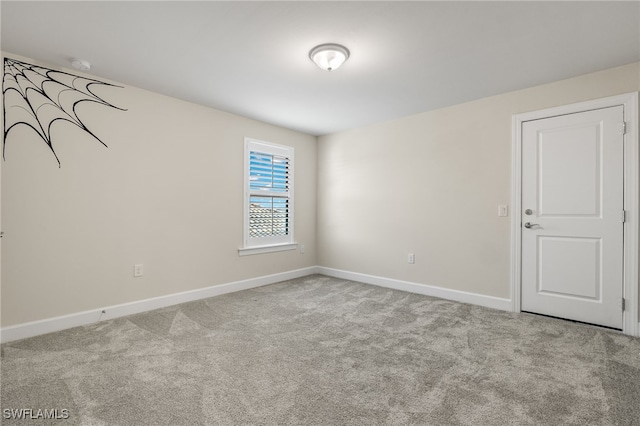 spare room with light carpet