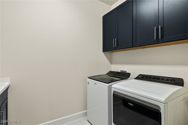 laundry room with cabinets and independent washer and dryer