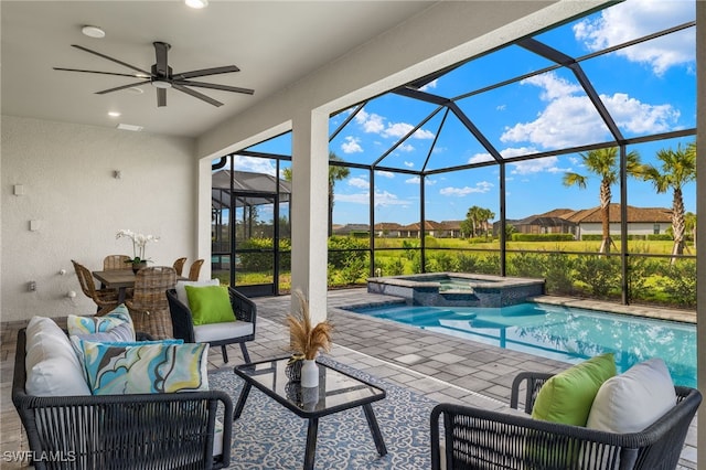 view of pool featuring ceiling fan, a lanai, an outdoor living space, a patio area, and an in ground hot tub