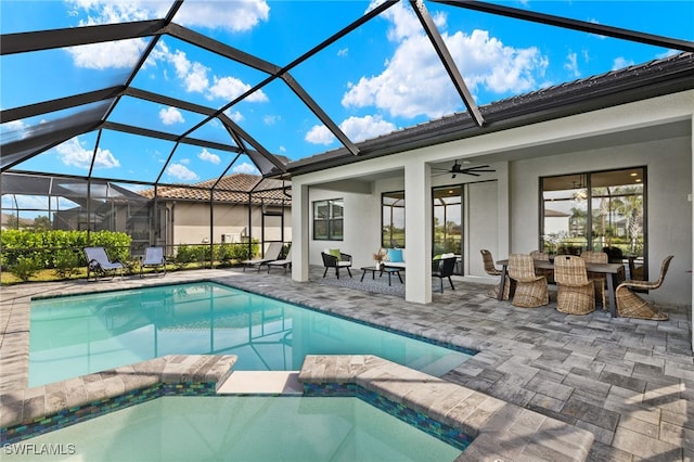 view of pool featuring ceiling fan, a patio area, and glass enclosure