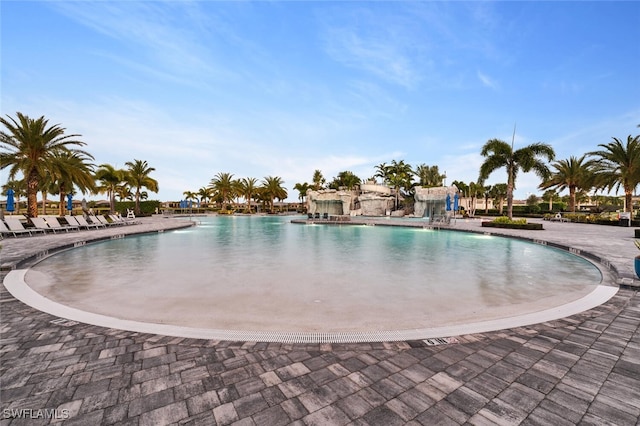 view of pool with pool water feature