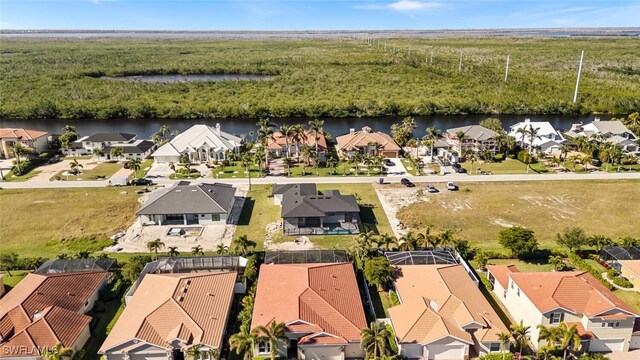 aerial view featuring a water view and a residential view