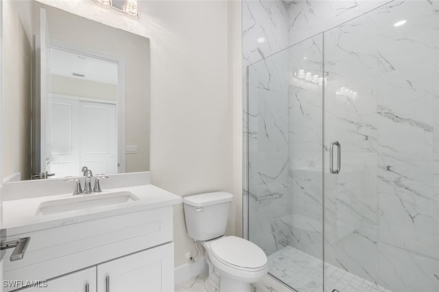 full bathroom featuring a marble finish shower, baseboards, toilet, marble finish floor, and vanity