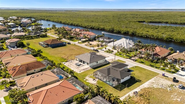 bird's eye view featuring a water view and a residential view