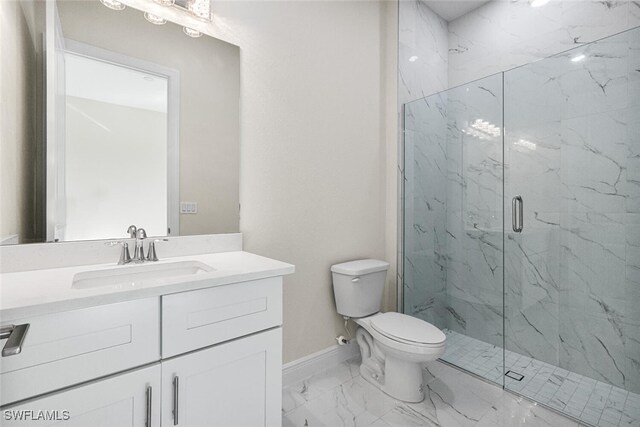 full bath with a marble finish shower, baseboards, toilet, marble finish floor, and vanity