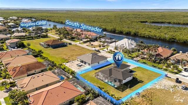 birds eye view of property with a water view and a residential view